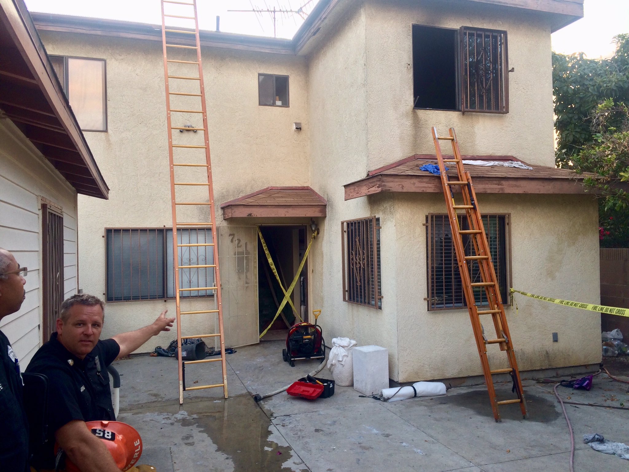 Front of home showing ladders in place