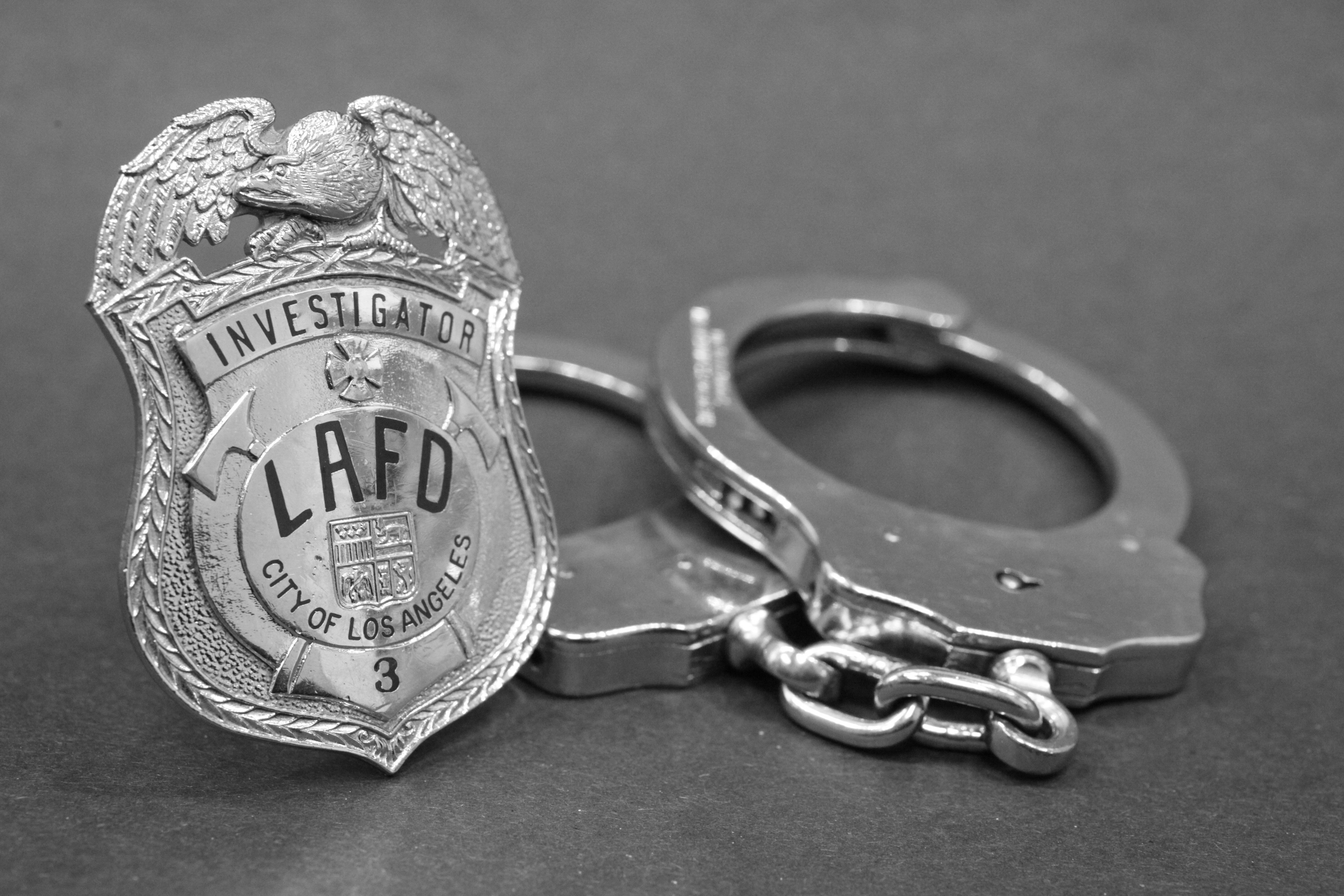 Arson Badge and handcuffs  