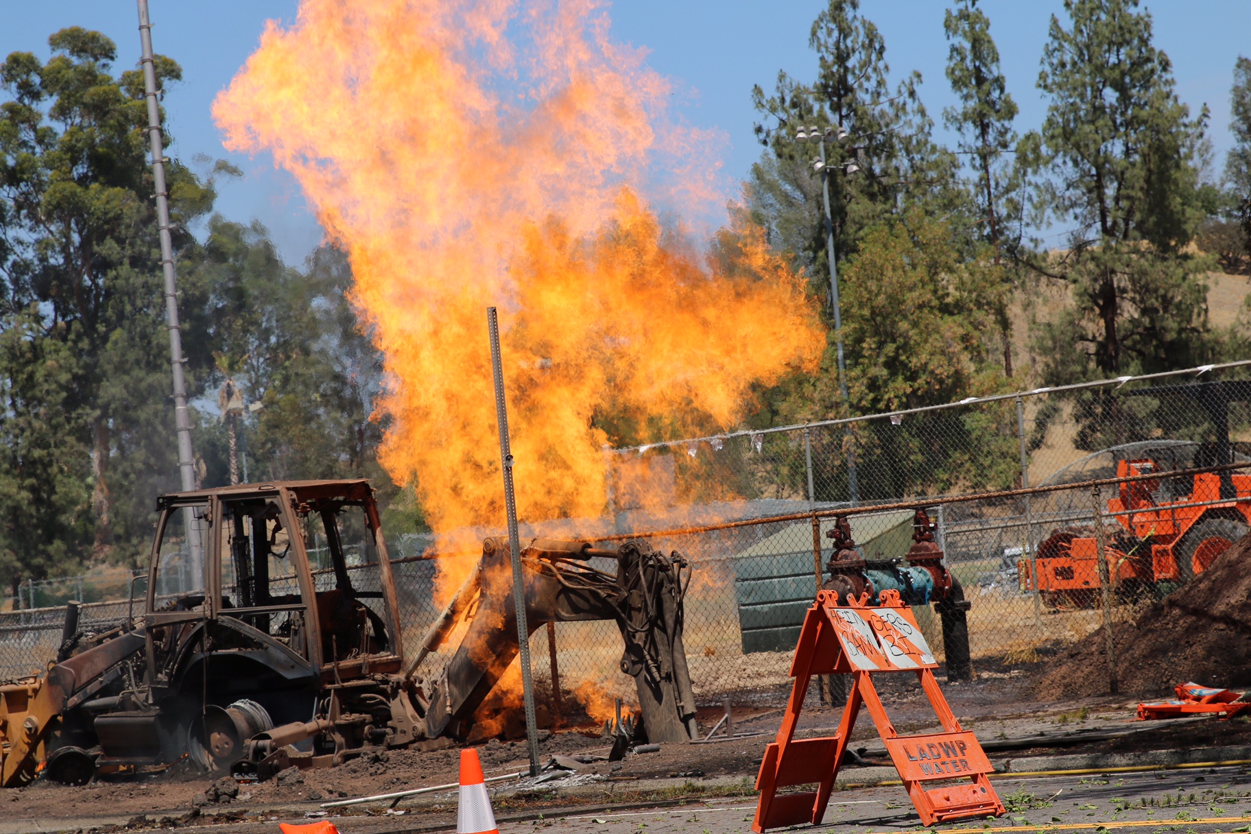 Tractor fully involved with fire