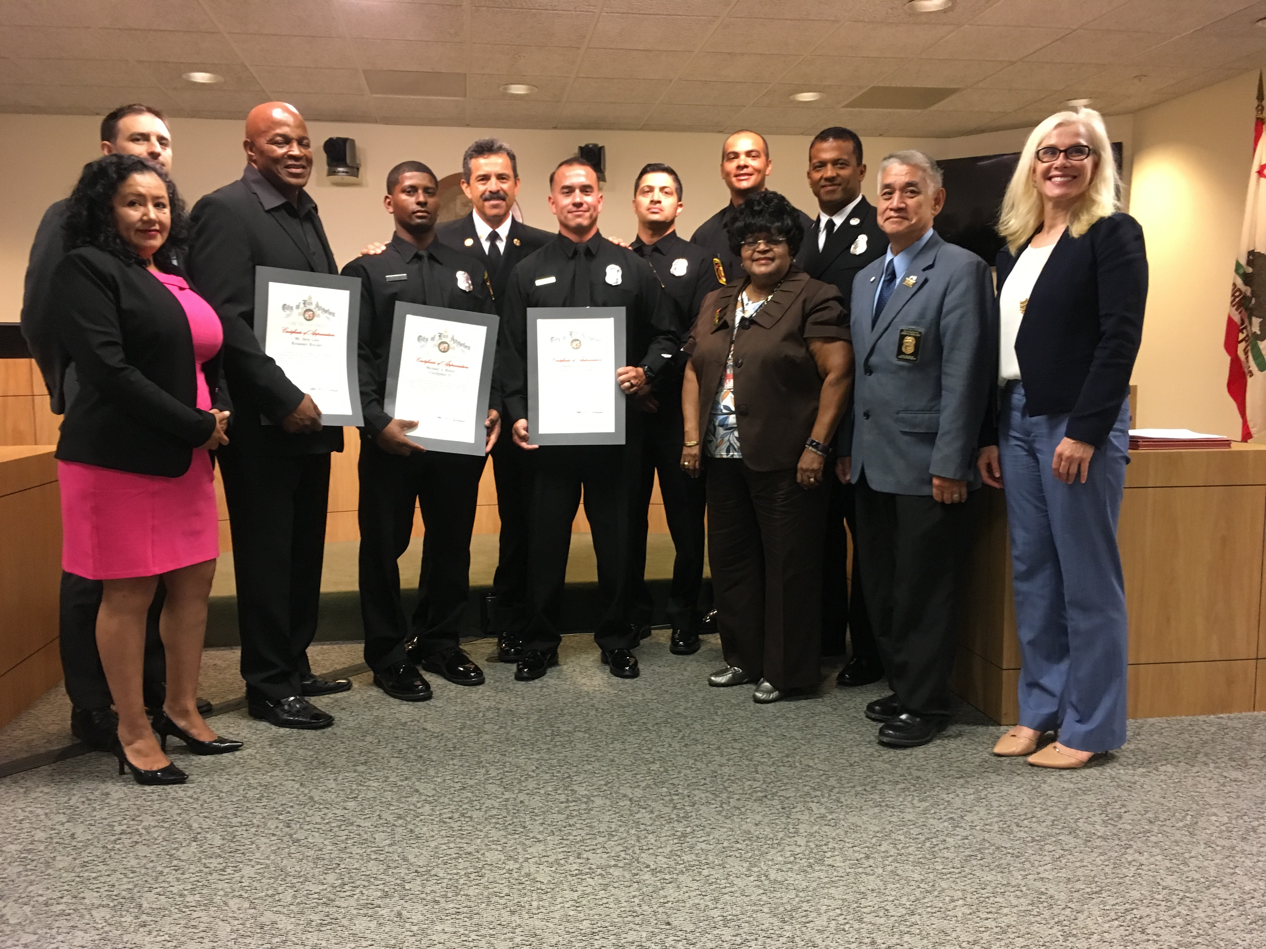 Honorees standing with Board of Fire Commission