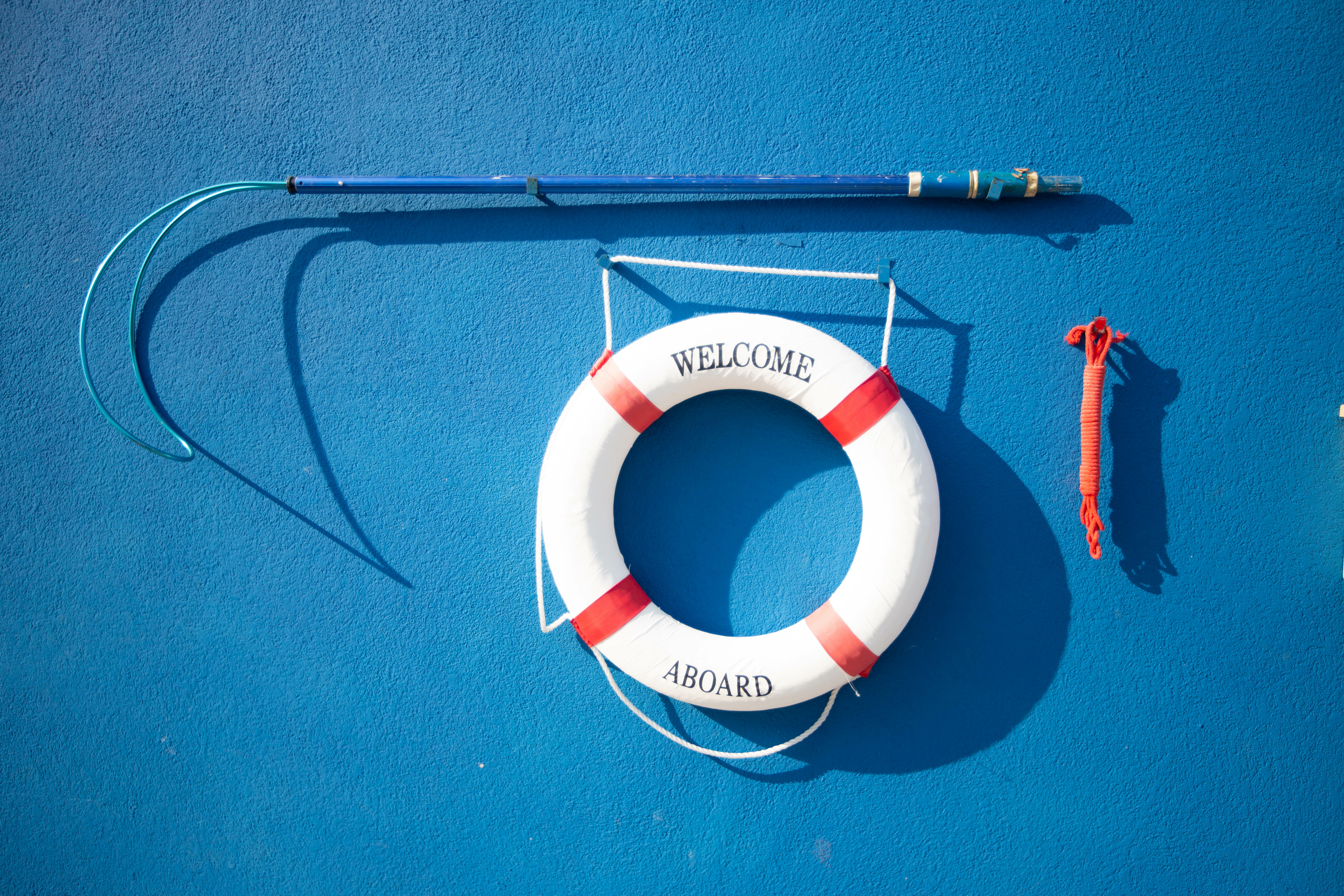 Life saving ring and reaching pole on a wall