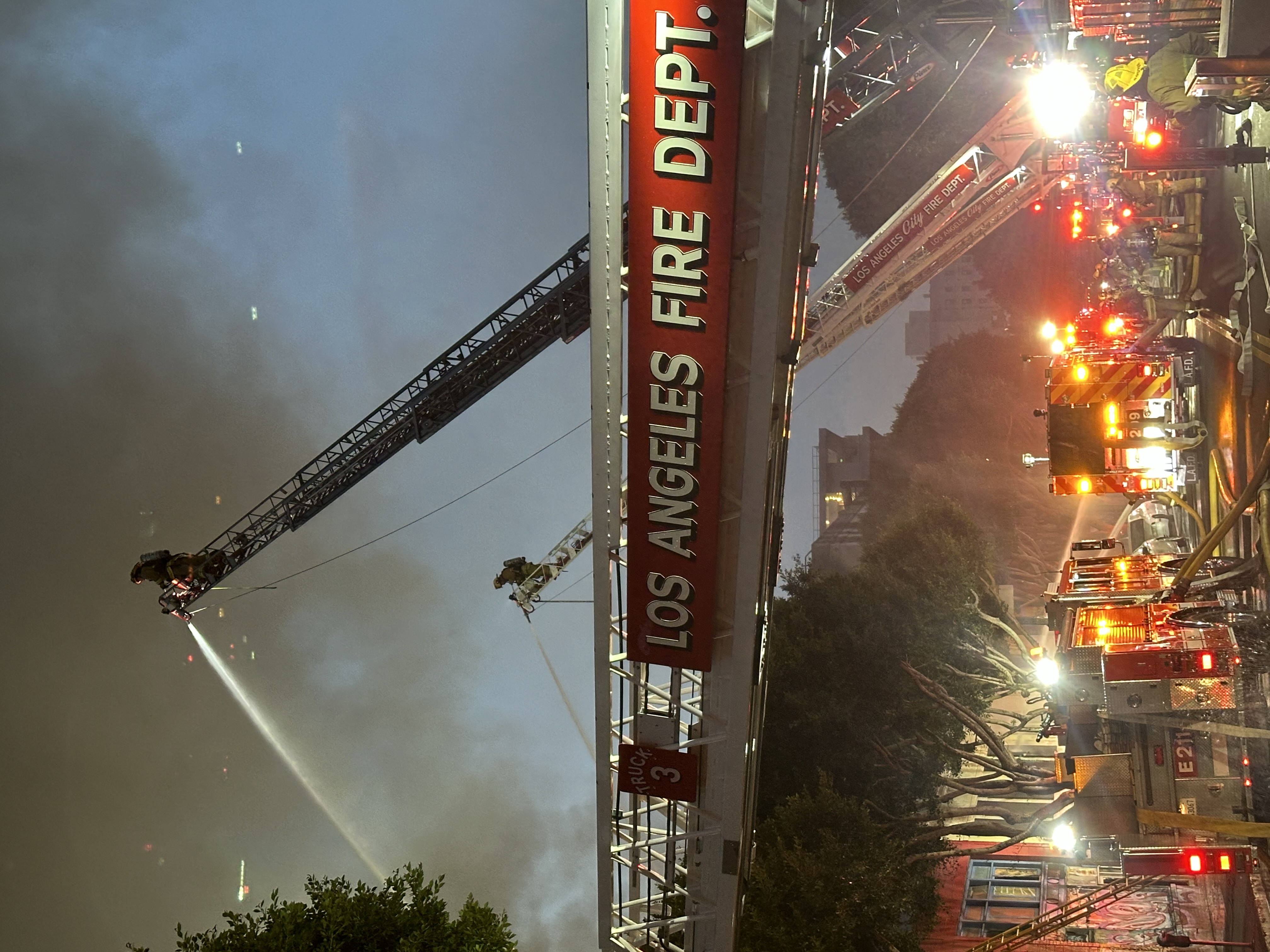 Firefighters and apparatus at a large commercial fire