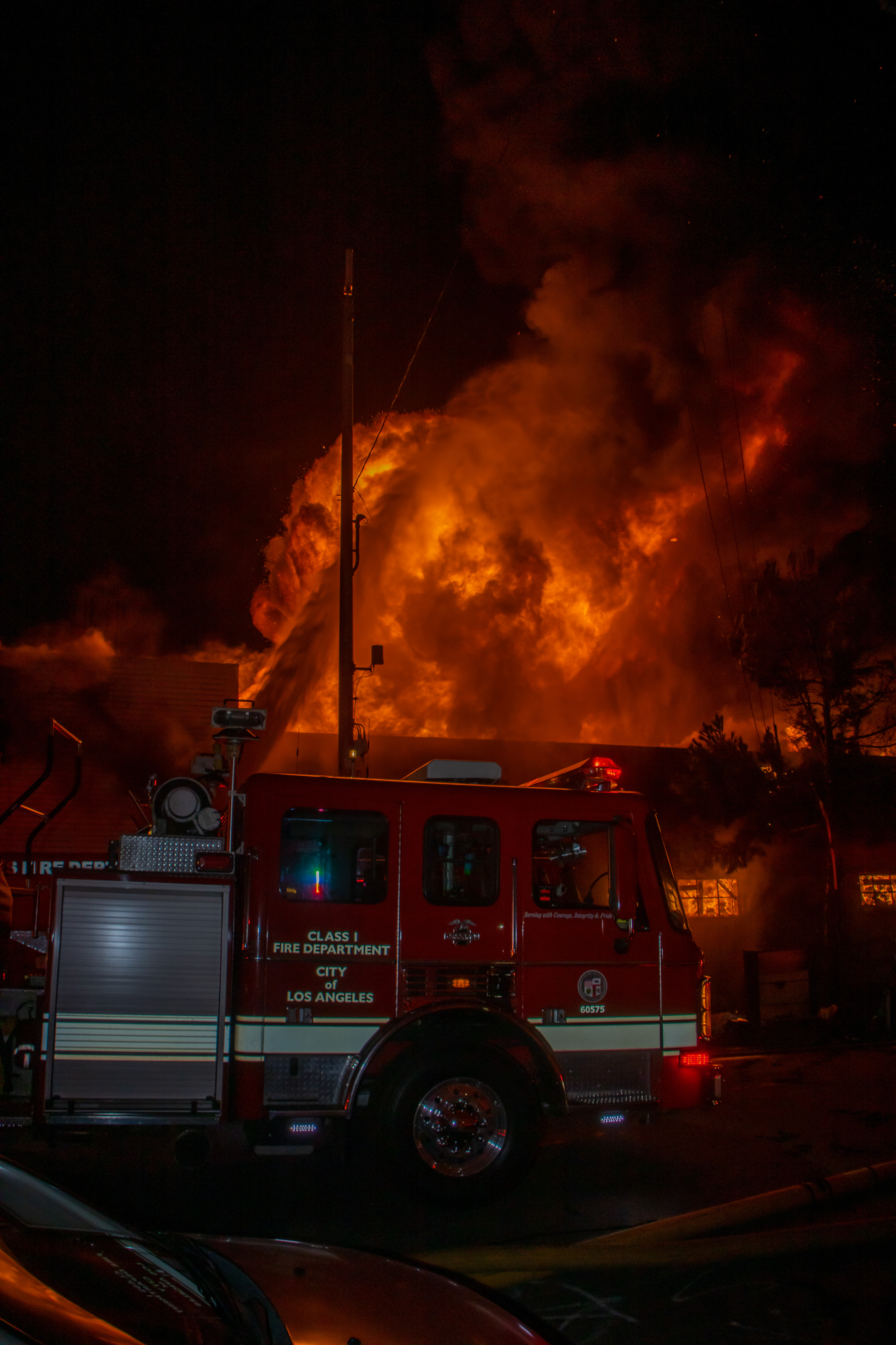 Heavy fire showing from a two story commercial building